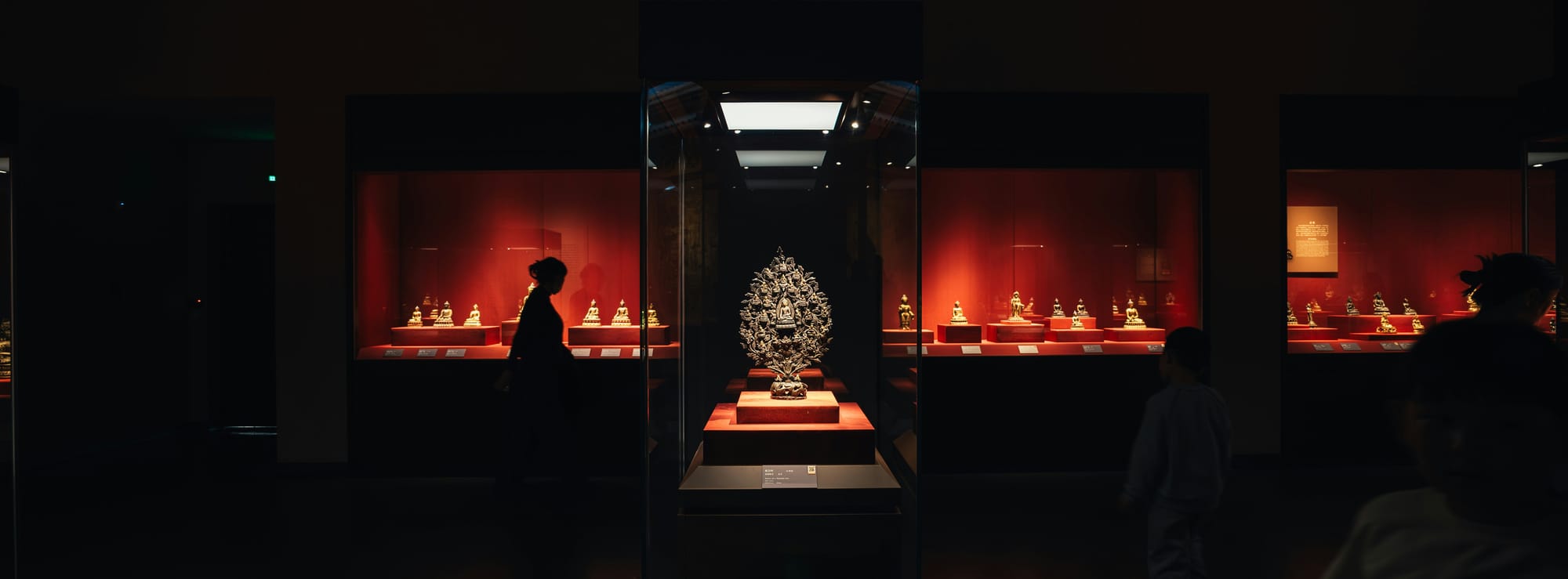 Museum display case with a single illuminated artifact